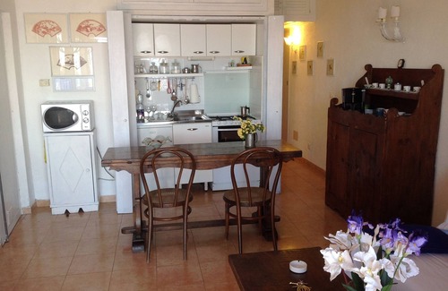 Cala Piccola Apartment | House with large terrace overlooking the sea, swimming pool, solarium, bathing establishment.
