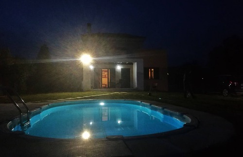 Eretria House | House with pool, garden and fireplace