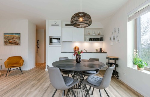 Westende Apartment | Huswell - Wide top-floor apt with private parking