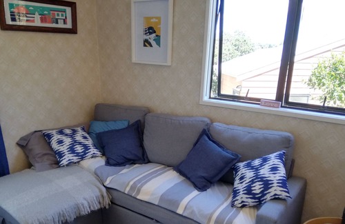 Red Beach Cabin | Iconic Kiwi Bach with sea views and a 2 minute walk to the beach.