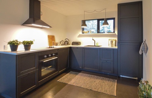 Faxe Ladeplads House | In the first row to the water lies the cozy cottage.