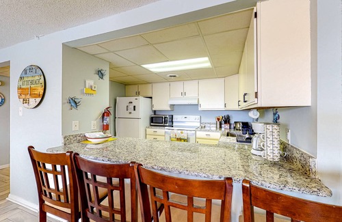 North Ocean City Condo | Inviting coastal condo with pool, balcony, full kitchen, & W/D