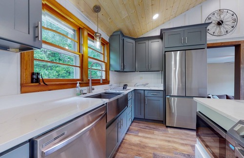 Penrose House | Inviting home with game room, firepit, full kitchen, central AC, & W/D