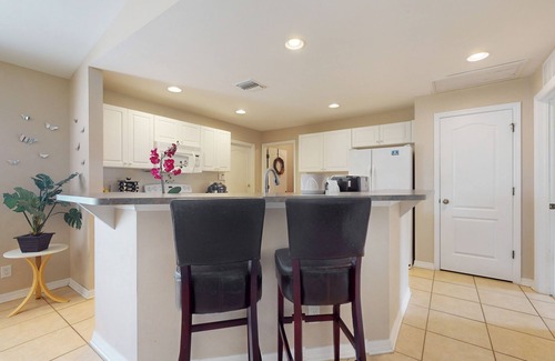 Jacarandas House | Inviting home with screened patio, central AC, full kitchen, & W/D