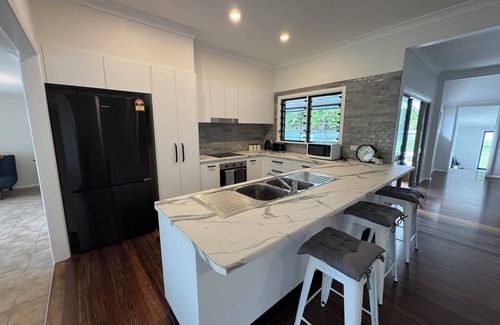 Daintree House | Just seconds from tours and dining, with a relaxing pool and spa to unwind