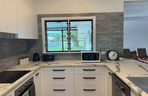 Daintree House | Just seconds from tours and dining, with a relaxing pool and spa to unwind