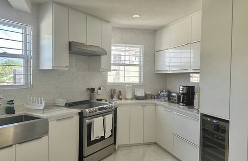 Fitts Village Apartment | Kick back and relax in this calm, stylish space
