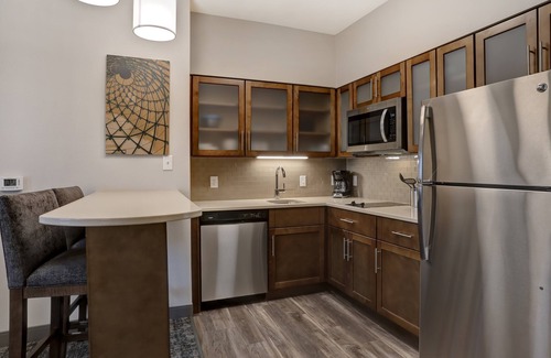 Overland Park Condo | King Suite. Free Breakfast. Pool. Shared BBQ.