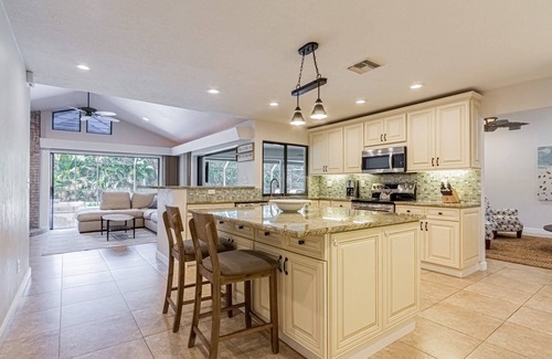Kings Lake House | Kings Lake: 3 BR home w/3 en suite baths, heated pool & expansive covered lanai w/outdoor TV