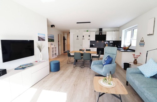 Tossens Apartment | KÜSTE33/48 - Family time. Sauna. Roof terrace.