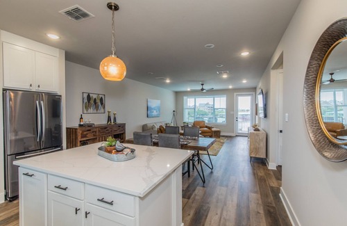 Graford Condo | Lake front Condo 2BD/2BA w/pool, hot tub, fire pit, gas grills, gym, & laundry.