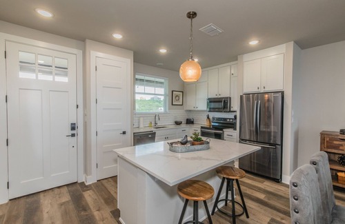 Graford Condo | Lake front Condo 2BD/2BA w/pool, hot tub, fire pit, gas grills, gym, & laundry.
