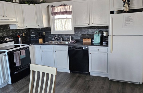 Kuttawa House | Lake House with easy water access, limited water view, sitting on 4 acres.