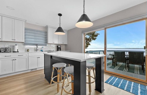 Cadillac House | Lake Mitchell Lakefront Retreat. Family-Friendly home to fish, swim, or ski!