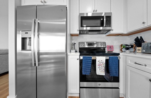 Cadillac House | Lake Mitchell Lakefront Retreat. Family-Friendly home to fish, swim, or ski!