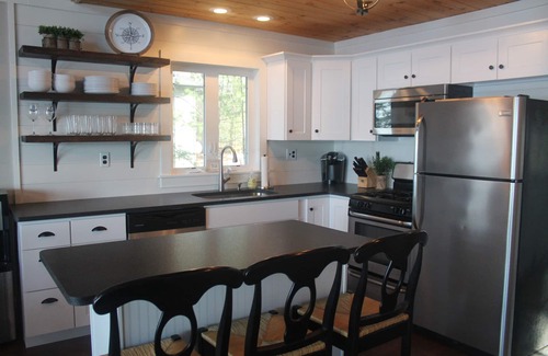 Lochmere House | Lake Winnisquam home with beach and private boat dock. 15 minutes to Gunstock.