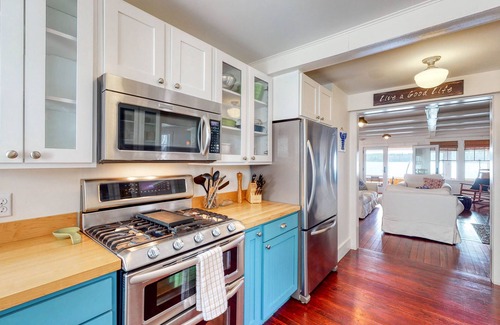 Monmouth House | Lakefront home with private dock, kayaks, firepit, grill, & sunroom