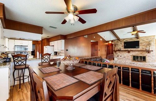 Kemp House | Lakefront retreat near golf course with serene wraparound deck, fireplace, & AC
