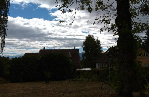 Prevessin-Moens House | Large double room, balcony, and view of large garden and the Alps