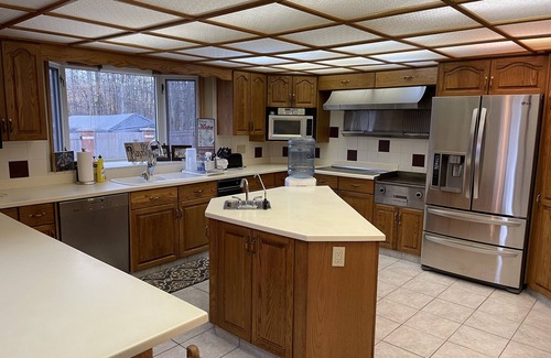 Sherwood Park House | Large family or group vacation lake home with dock and boats 35 minutes from WEM