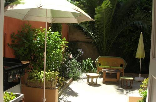 Les Remparts Apartment | Large T2 of character, downtown with garden/patio.