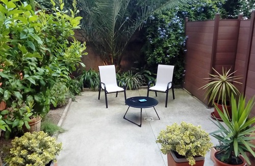 Les Remparts Apartment | Large T2 of character, downtown with garden/patio.