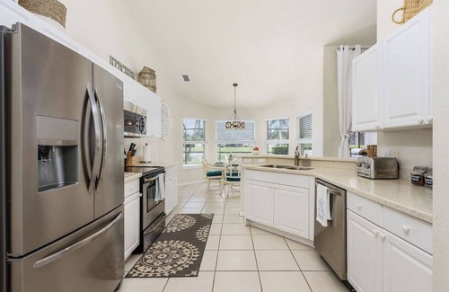 Central Naples House | Lazy days & lake views. Beautiful Naples pool home in Briarwood