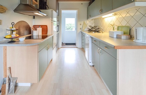 Kongsnæs House | Look forward to a vacation in this child-friendly vacation home with a beautiful fenced garden.