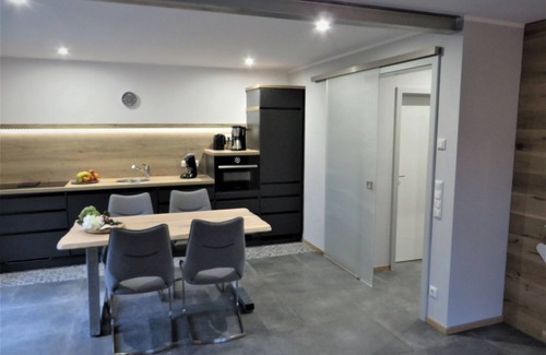 Berumbur House | Look forward to relaxing on approx. 54 square meters of living space in the Berumbur vacation park near the North Sea coast. Our facilities: fenced property (ideal for dog owners), parking space, garage for bicycles/e-bikes, underfloor heating.