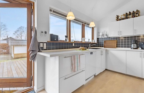 Skibby House | Look forward to this light-flooded and beautiful vacation home with a spacious wooden terrace.