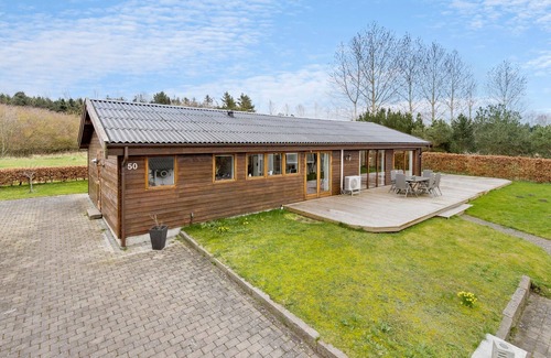 Skibby House | Look forward to this light-flooded and beautiful vacation home with a spacious wooden terrace.