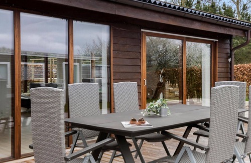 Skibby House | Look forward to this light-flooded and beautiful vacation home with a spacious wooden terrace.
