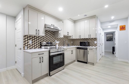 Southeast Calgary House | Lovely 2Bedroom/1Bath Private Suite + Free parking + Separate HVACnEntire Suite!
