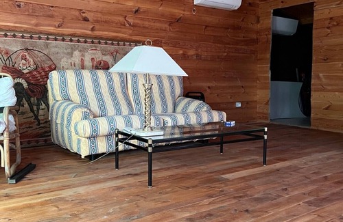 San Martino in Rio Cottage | Lovely wooden accommodation surrounded by greenery