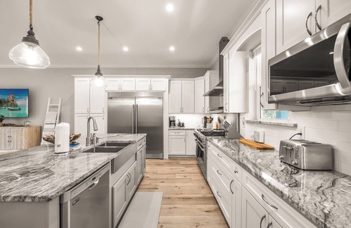 Vilano Beach House | Luxury beach escape, 2 blocks to the ocean & 1 block to the river! Enjoy a heated pool, hot tub, paddle boards, kayaks, golf cart & more—only 10 mins to downtown St. Augustine. Very clean, well stocked & perfect for couples, families & small groups.
