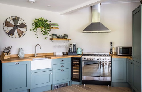 Barns Green House | Luxury Boathouse situated on a private lake, with panoramic views and a hot tub.
