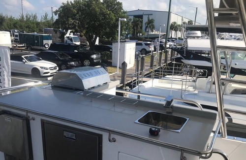 Flag Hill Boat Rental | Luxury Catamaran with Four Bedrooms, Fwd and Aft Deck, Private Patio, Swim Lift.