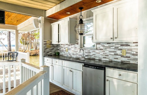 Henrico House | Luxury Lakefront Escape with Sunset Views, Private Boathouse, and Endless Fun!