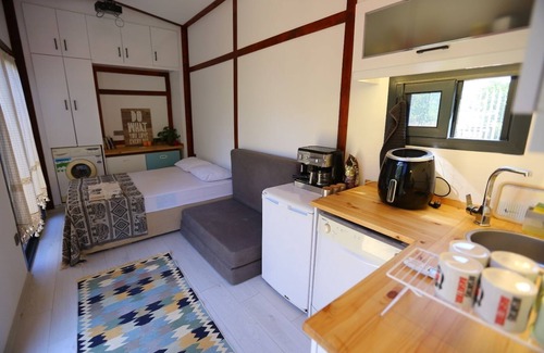 Gumusluk RV Rental | LUXURY TINY HOUSE 50 METERS TO SEA & GARDEN-BAR-RESTAURANT