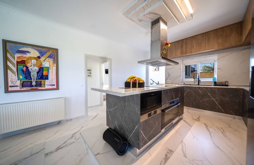 Stavros Villa | Luxury White House - Family Villa Near Sea - Zorbas Beach with playground, bikes
