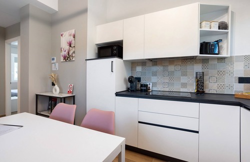Vimercate Apartment | Magnolia: garden and parking. Vimercate/Monza