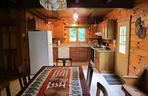 Dryden Cabin | Maine Lakeside log cabin: 3bed 2bath: hot tub-boats-swim raft-firepit- privacy!