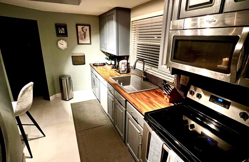 Coral Ridge Isles House | Maison Gris exclusive resort style paradise with a heated pool.