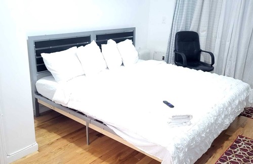 West Side Apartment | Master bedroom with bathroom. With Fridge, Mircowave . 50 Inch LCD, etc.