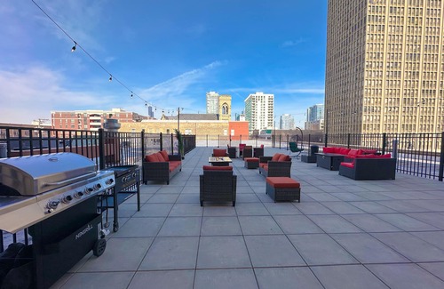 Near South Side Apartment | McCormick Place Patio skyline unit with optional Parking for up to 6 people