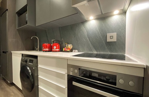 Menlyn Apartment | Menlyn Maine Residence King sized bed with patio - Paris