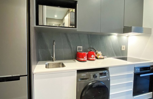 Menlyn Apartment | Menlyn Maine Residence King sized bed with patio - Paris