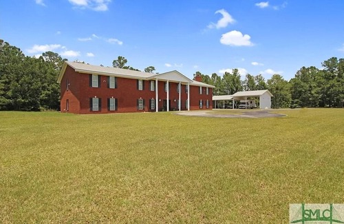 Fleming House | Midway Manor Awaits You with 7 bedrooms, 5 Bathrooms, and Unlimited Charm