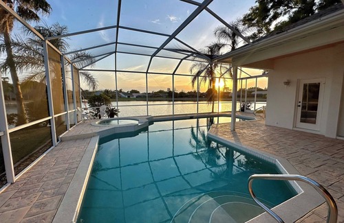 Naples House | Million dollar lake views; 4-bed 3 bath pool house- Old World Charm in Naples FL