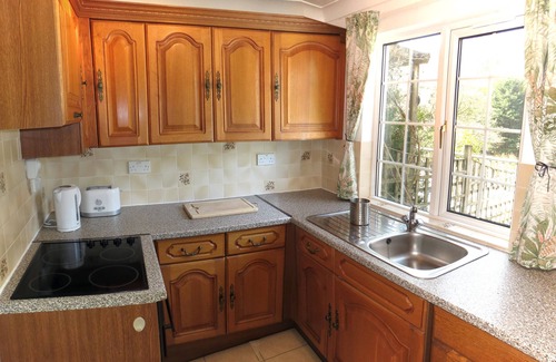 Mount Cottage | Millpool Lodge peaceful haven with 3 acre stunning gardens waterfalls and hottub